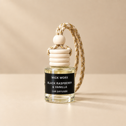 Black Raspberry & Vanilla car diffuser on a simple warm neutral background